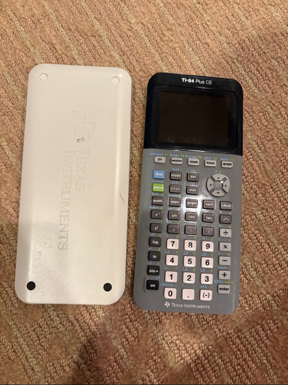 Texas Instruments Ti 84 plus CE Graphing Calculator in Gray and White